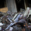 A child examining the vestiges of a house obliterated by an Israeli airstrike in the Al Sheikh Radwan neighborhood in Gaza City on July 11, 2014 (via activestills.org)